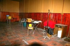 Tables, chairs, coat rack, service cart.