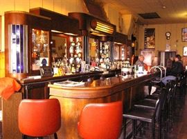 Art Deco  style Front & Back Bar is from the 1930's.  Mahogany wood.  The service bar has been carved out of one piece of walnut.