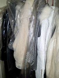 Several closets full of Fur, faux fur, leather and other types of jackets and coats!