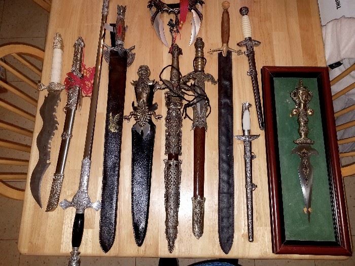 Enormous display of collector pocket knifes, daggers, replica guns and more...