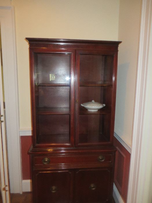 Mahogany china cabinet. two glass doors , one drawer and two doors at bottom