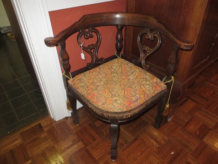 One of three English Oak corner chairs