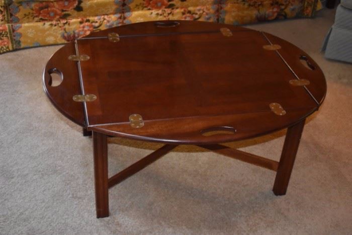 Beautiful Oval shaped Coffee Table with Drop Leaf Sides that effectively turn this Occasional Table into a Rectangular Table.
