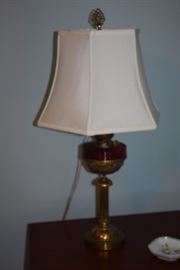 A Closer Shot of the AntiqueTable Lamp that has a Brass Base and Alladin Lamp Design