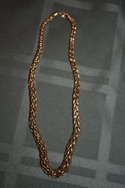 Gorgeous 14kt Gold Necklace: One ladies 14kt yellow gold hollow style graduating interlocking weave style necklace measuring approximately 17" in length and weighs approximately 9.07 dwt and measures approximately 8mm wide at bottom and 4.5mm wide at back.