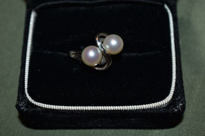 Beautiful Pearl Ring! One ladies 14kt white gold bypass style ring mounting weighing approximately 2.27dwt and is set with two (2) round white cultured pearls each measuring approximately 7mm in diameter.