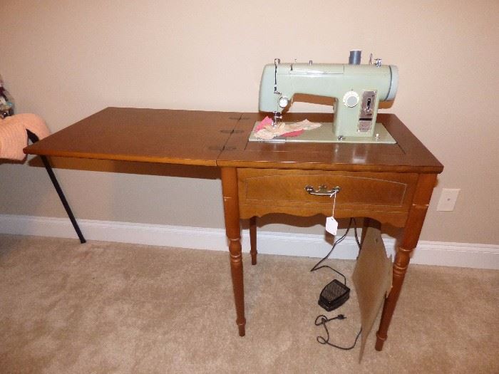 Vinage Kenmore sewing machine in cabinet