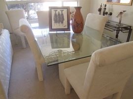 Dining Room Table/6 Chairs.  Southwest Log- Designed Pedestals with Glass Top.  Parson's Chairs are in a creamy white upholstery.