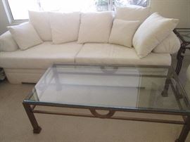 Contemporary Design Sofa with matching Love Seat.  Metal and Glass Coffee Table.