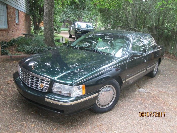 1997 CADILLAC DEVILLE D'ELEGANCE 102,900 MI. THIS CAR IS IN VERY GOOD CONDITION. IT IS A DARK GREEN EXTERIOR WITH CREAM LEATHER SEATS & INTERIOR