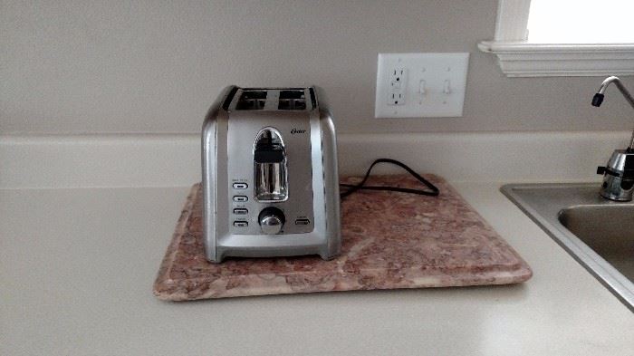 Oster toaster and marble cutting board