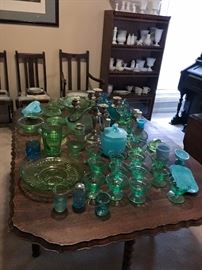 Vaseline glass! On top of a lovely scalloped edge gate leg oak table. 
