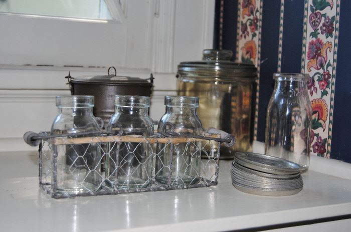 Old lunch pail, milk bottle, glass jar with lid