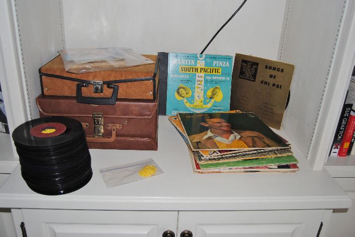 Two cases of cassette tapes, albums and 45s.