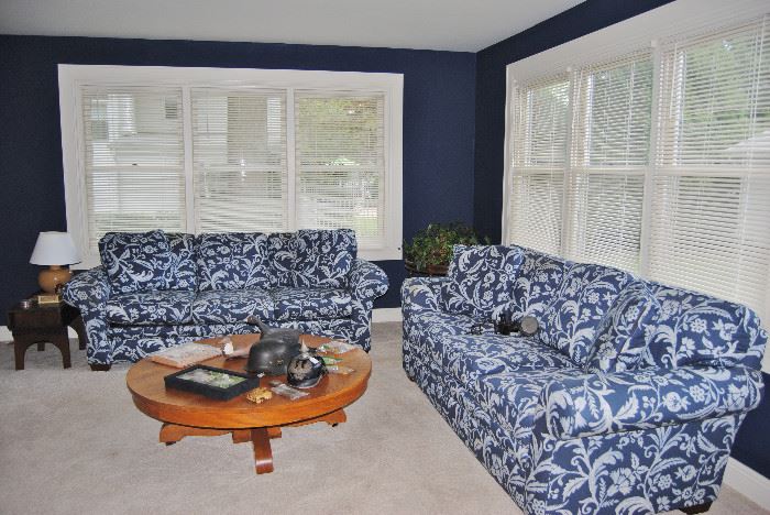 Matching Broyhill sofas with interesting blue and white pattern (new in 2012). Antique round oak table that has been cut down for use as a coffee table. 