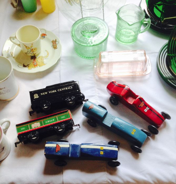 Assortment of Children's Toy Trains and Racers; Depression Glass; and Children's dishes.