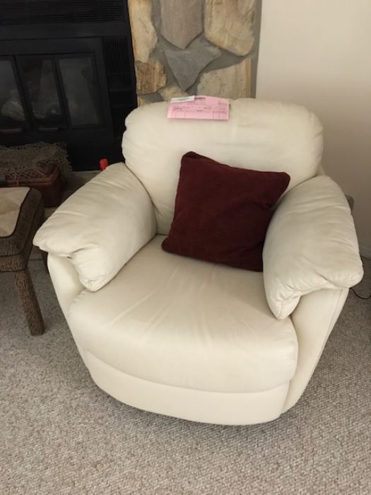 One of two swivel armchair