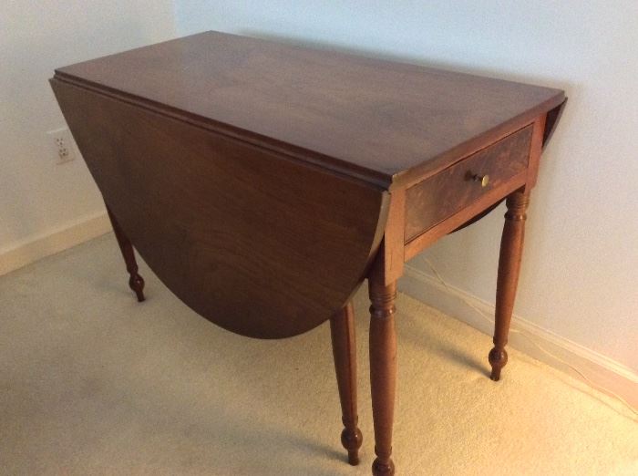 Table with Folding Leaves. 28 1/2" H x 43 1/2" L x 21" W  28 1/2" (with leaves folded down). 