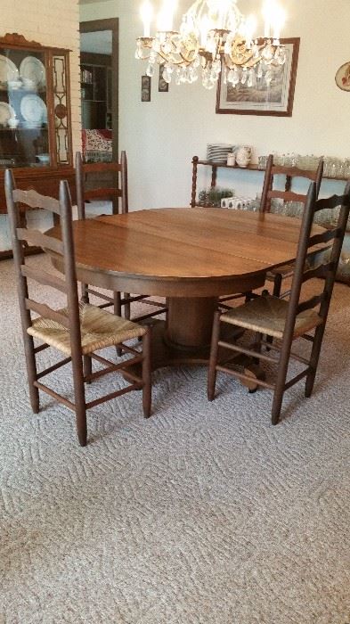 Table with leaves, 6 ladderback chairs, vintage china cabinet, storage shelving with Christmas dishware, & American Prescut glassware--extensive collection with duplicates!  Including punchbowl!