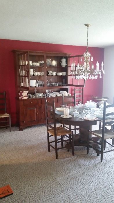 Upstairs formal dining room, custom-signed Amish china cabinet (made in Pennsylvania), round dining table (with 2 handmade extension leaves), 6 ladderback chairs, & multiple sets of china.