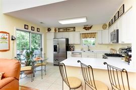 Charleston Forge Dining Table with chairs and counter top stools.