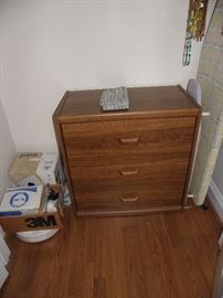 Small chest of drawers.  Roomba and Mint floor cleaners