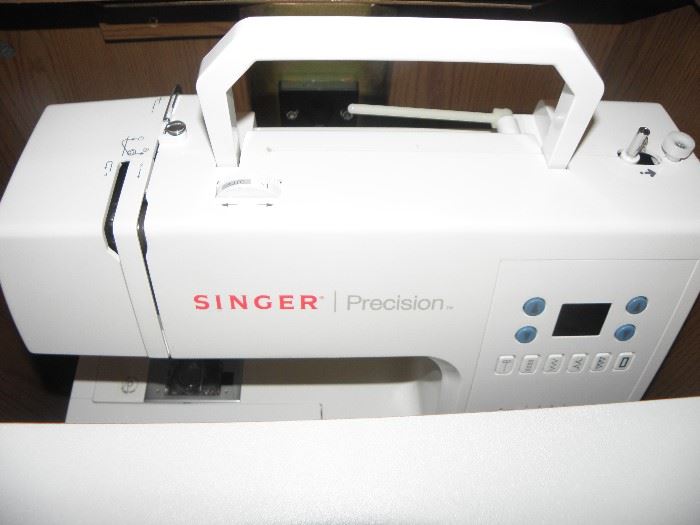 Singer Precision sewing machine in "wood" cabinet