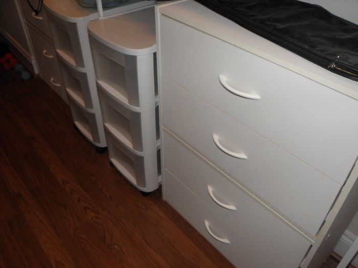 White chest of drawers and other storage towers.