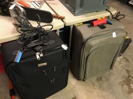 Two of several pieces of luggage
