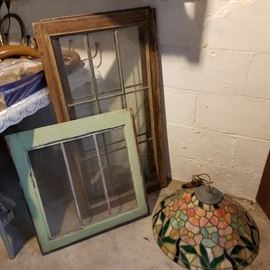 In the basement now....  Vintage windows and a stained glass lamp shade