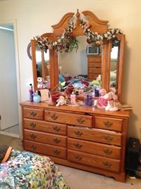 The dresser with tri-fold mirror
