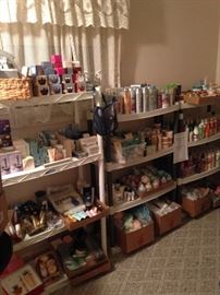 Three of several shelving units stocked with new Avon products!