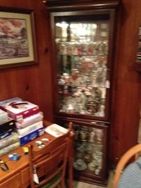 Curio cabinet stocked with collectible dolls!