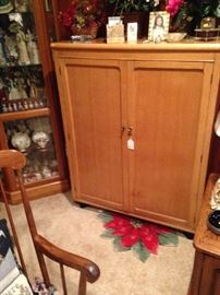 Nice wood cabinet has many uses!