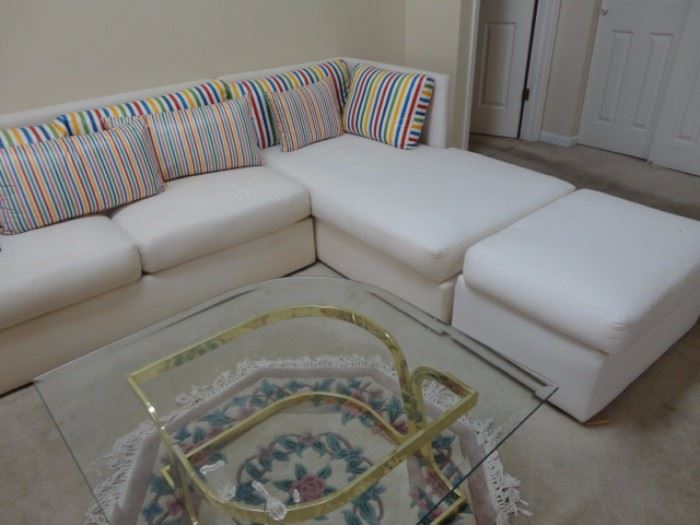 couch sectional beautiful white with accent primary colorful pillows Leon Rosen PACE coffee table with rose area rug