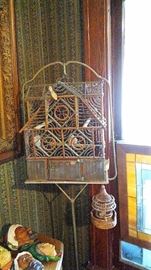 One of several vintage bird cages