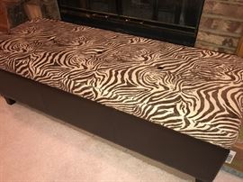 Storage ottoman with animal print top