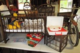 Antique child's crib, vintage GE record player, vintage puzzles, Christmas lights, antique trike