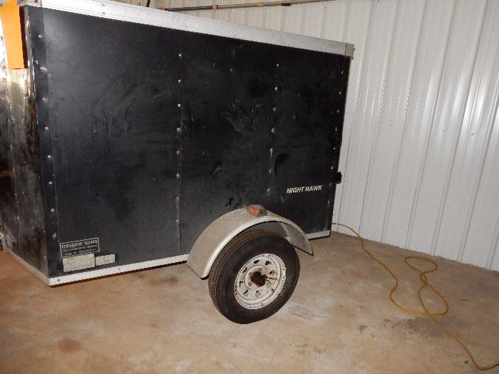 ENCLOSED TRAILER NIGHTHAWK, APPX 7 FEET BY 5 FEET ACROSS THE BACK