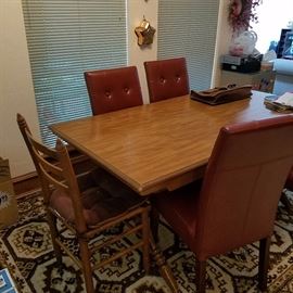 Kitchen table and various chairs.