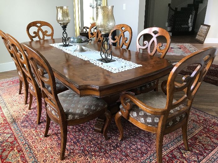 Thomasville's dining table with 8 chairs. Can seat up to 10 with an extra leaf(included)