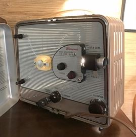 Now this is really cool because it is in wonderful condition. Brownie Movie Projector 8mm. Runs like a charm. Case is there and in tact.