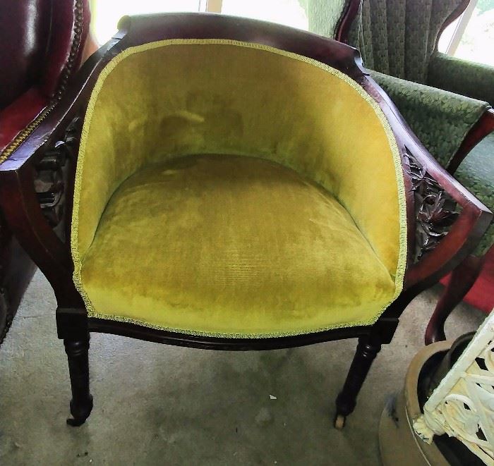 antique accent chair with ornate arms     LIVING ROOM