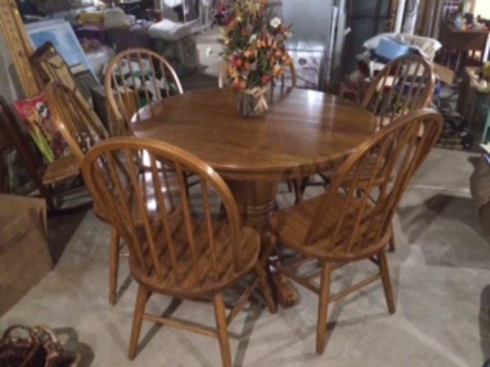 Oak Pedestal Table w/six chairs and a leaf.  Excellent condition