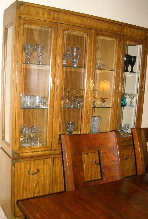 Large, 3 light Thomasville china cabinet with storage in base.