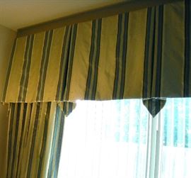 Color is not good in this picture, but there are several custom window treatments for sale throughout the home.