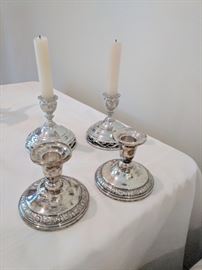Pewter and silver candlesticks