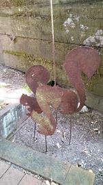 Metal yard art squirrels