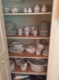 Mikasa porcelain everyday dishes with serving pieces and slow cookers on the bottom shelves!