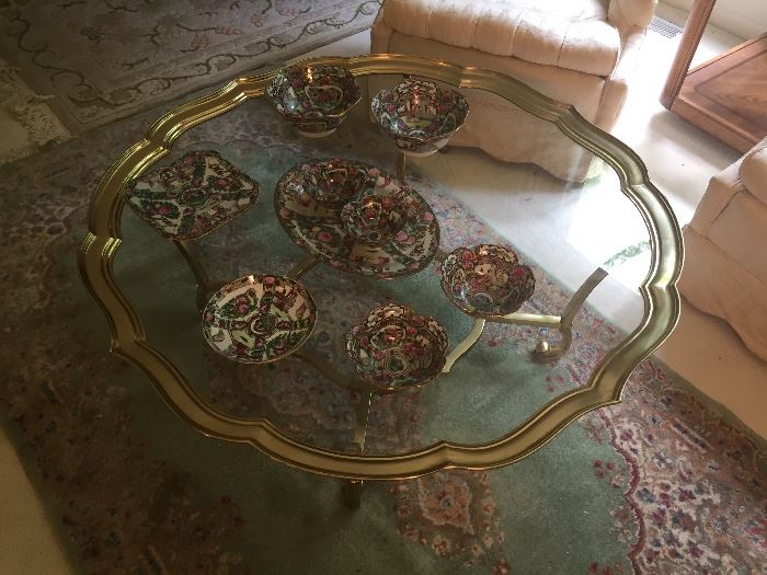 Brass and Glass round coffee table, and wool area rug.  Also asian porcelain pieces